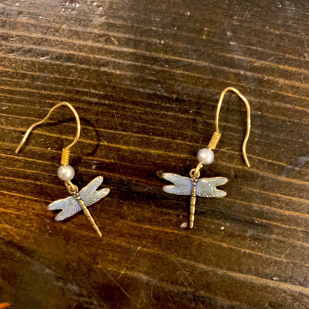 Purple dragon fly earrings.